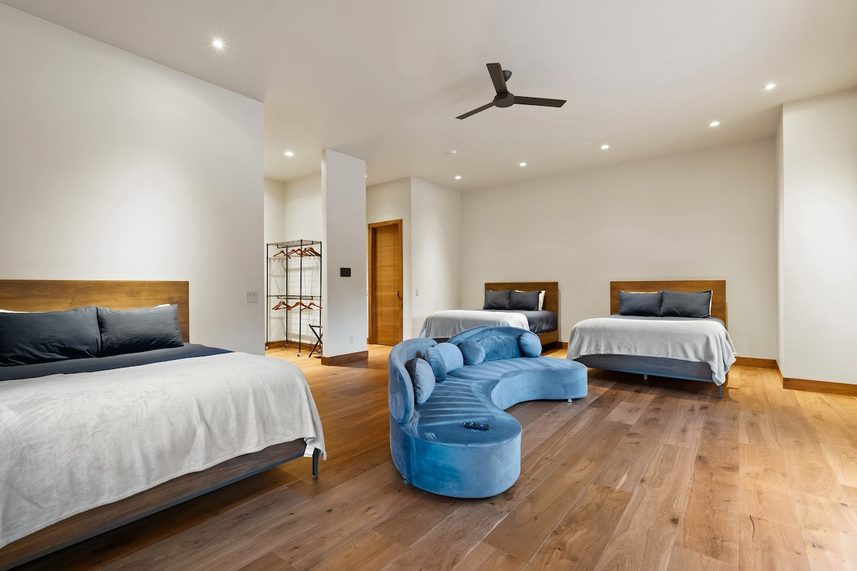 A bedroom with a reading chair at The Driftwood