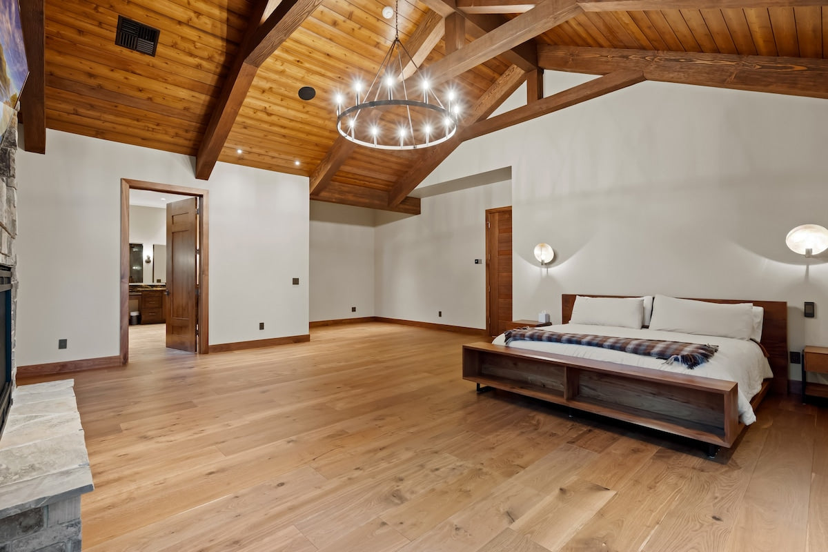 The primary bedroom under the beams at The Driftwood