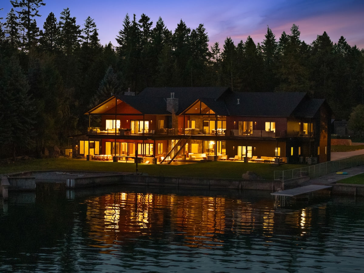 The house from the water at dusk at The Driftwood