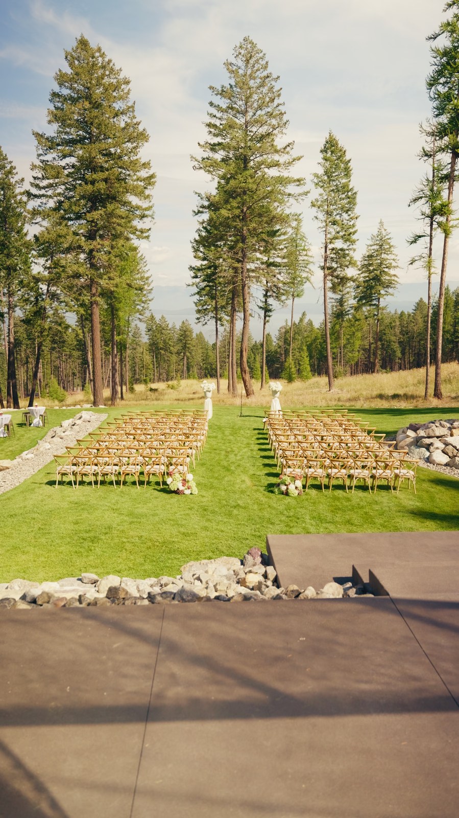 The ceremony lawn set for a wedding, with the trees and the lake beyond
