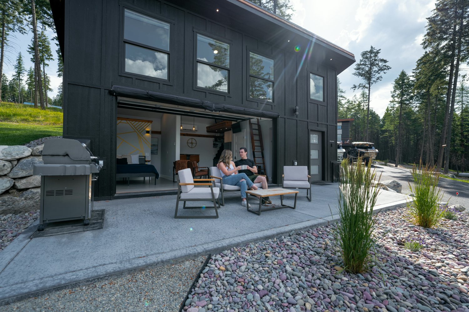 The Lakeside House with its glass door open onto the patio
