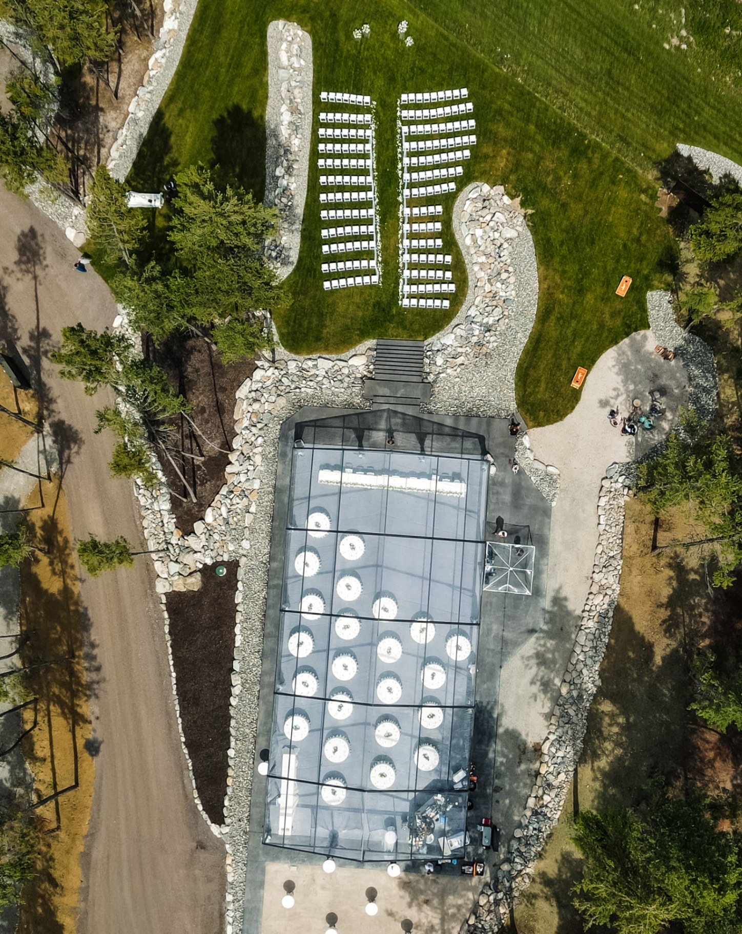 The tent and ceremony lawn from the air at golden hour
