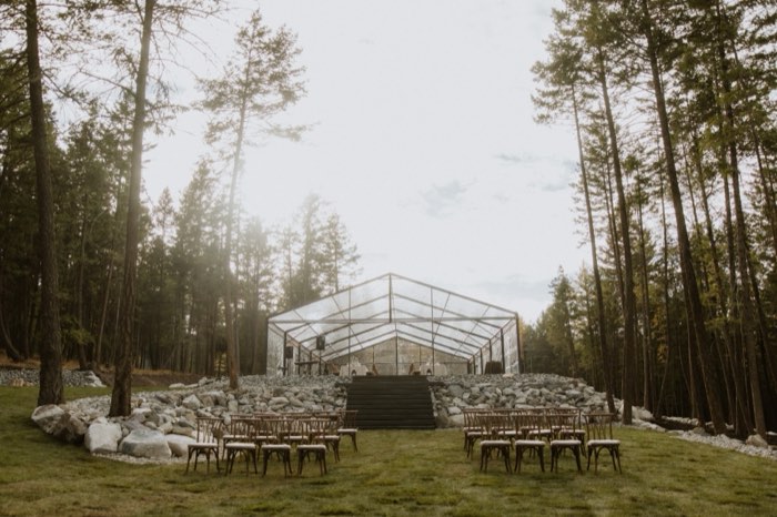 Ceremony seating with the tent and lake behind